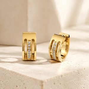 Luma Line Hoops with sculptural gold-tone design and crystal centre line